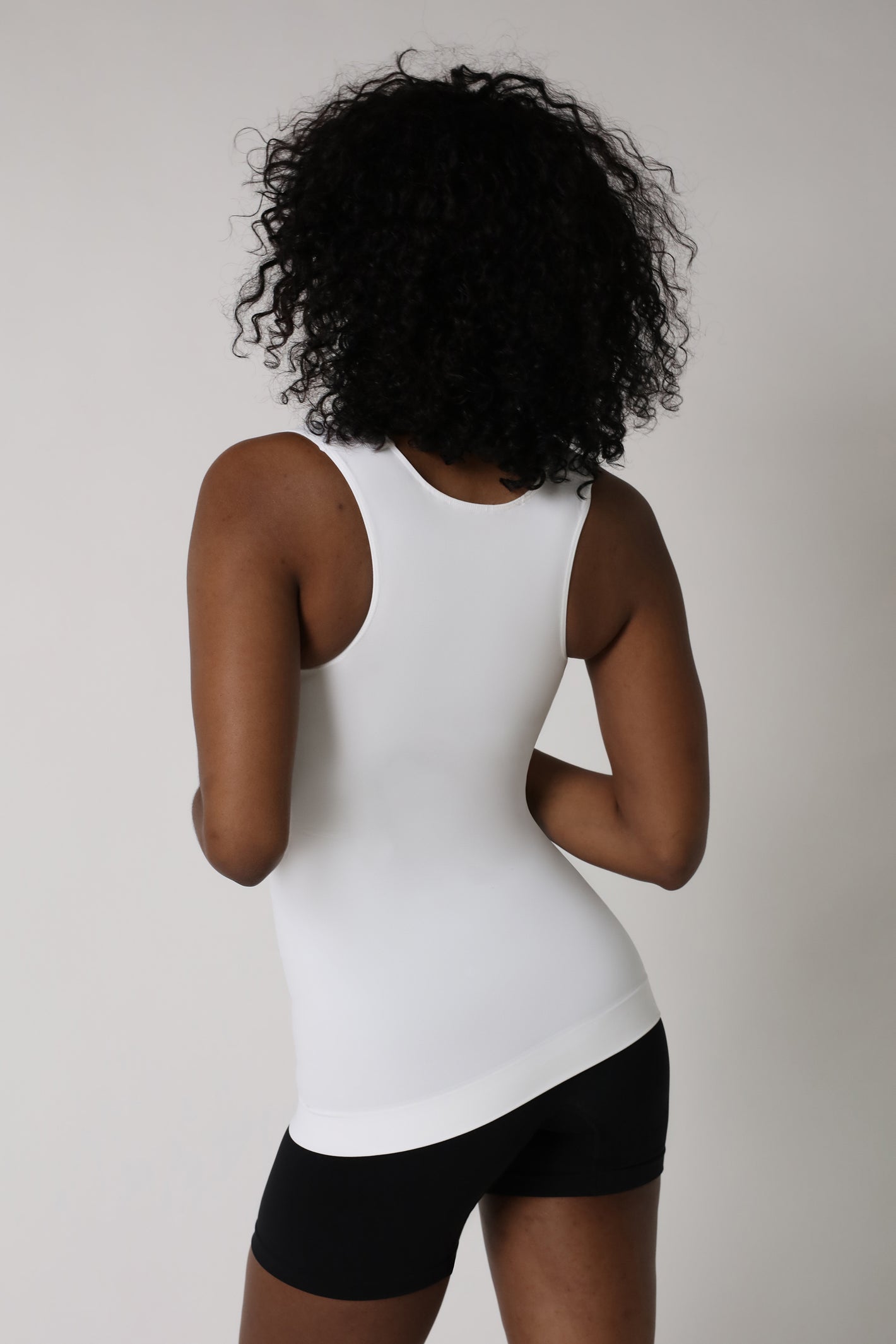 lady wearing shapewear tank top from back - White